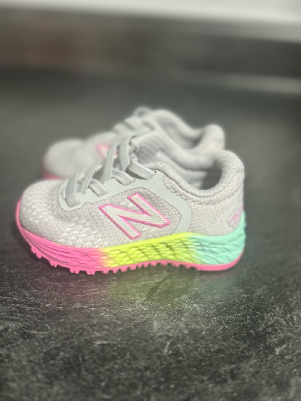 New Balance Kids Light Gray Sneakers with Pink & Rainbow Gradient Sole